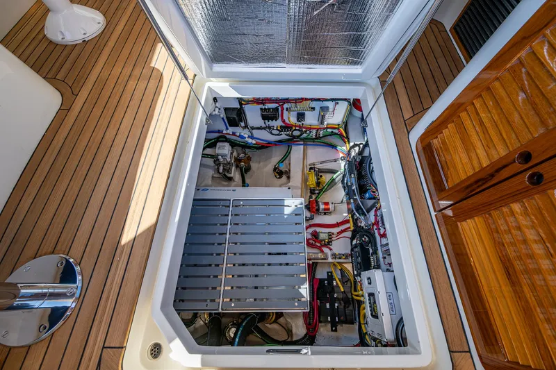 Yacht Photos Pics Engine compartment of 2025 Hinckley Picnic Boat 40, showcasing wiring and components.