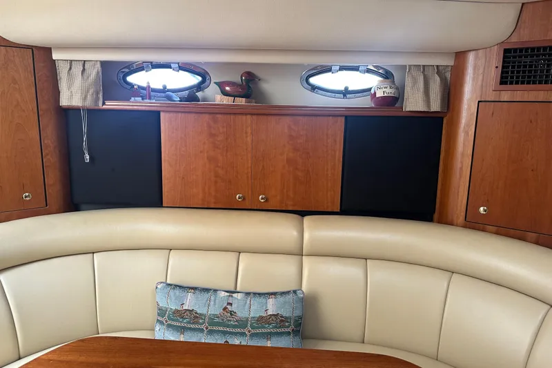 Sandman Yacht Photos Pics Interior of 2001 Cruisers Yachts 3870 Express with wood cabinets and leather seating.