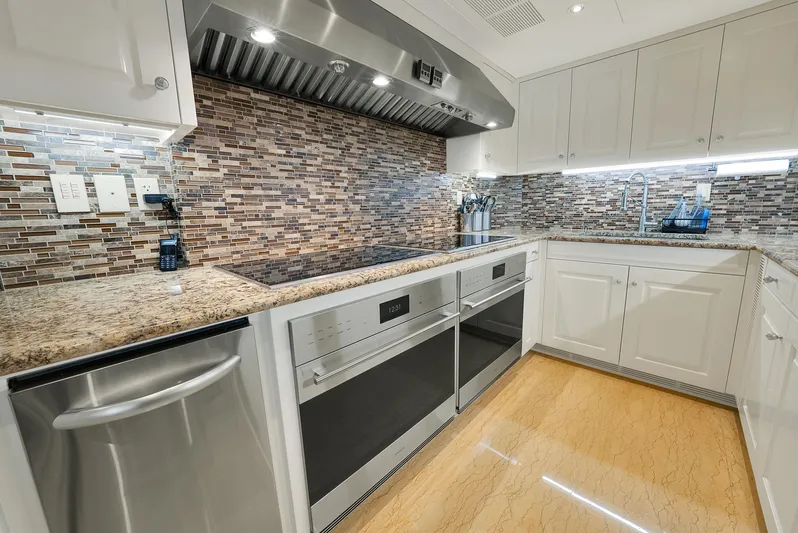 Silver Lining Yacht Photos Pics Luxurious kitchen in 2016 Christensen Tri-Deck yacht with modern appliances and elegant design.