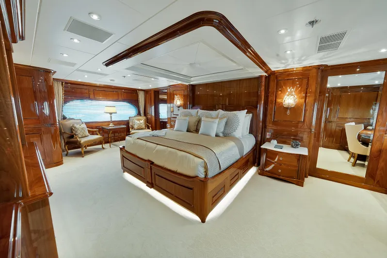 Silver Lining Yacht Photos Pics Luxurious 2016 Christensen Tri-Deck yacht bedroom with elegant wood paneling and plush furnishings.