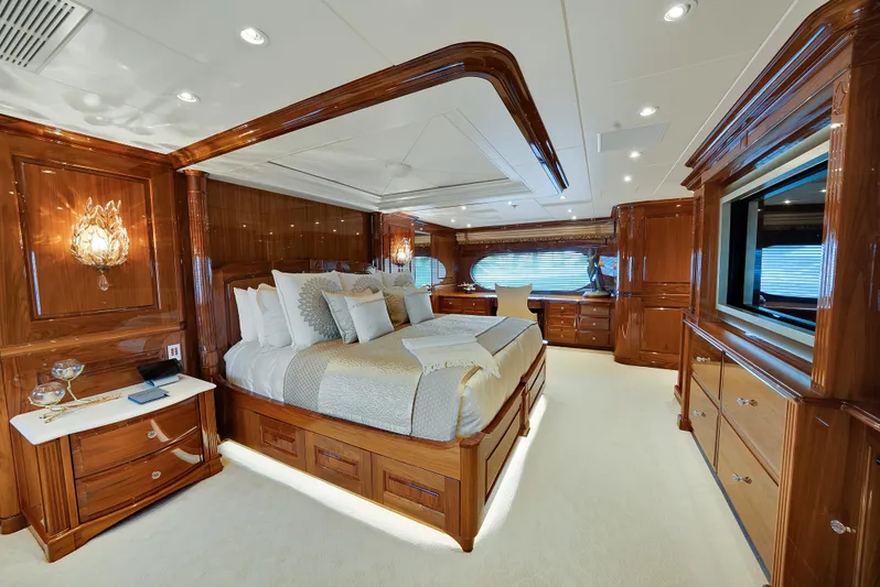 Silver Lining Yacht Photos Pics Luxurious bedroom interior on 2016 Christensen Tri-Deck yacht with elegant wood finishes.