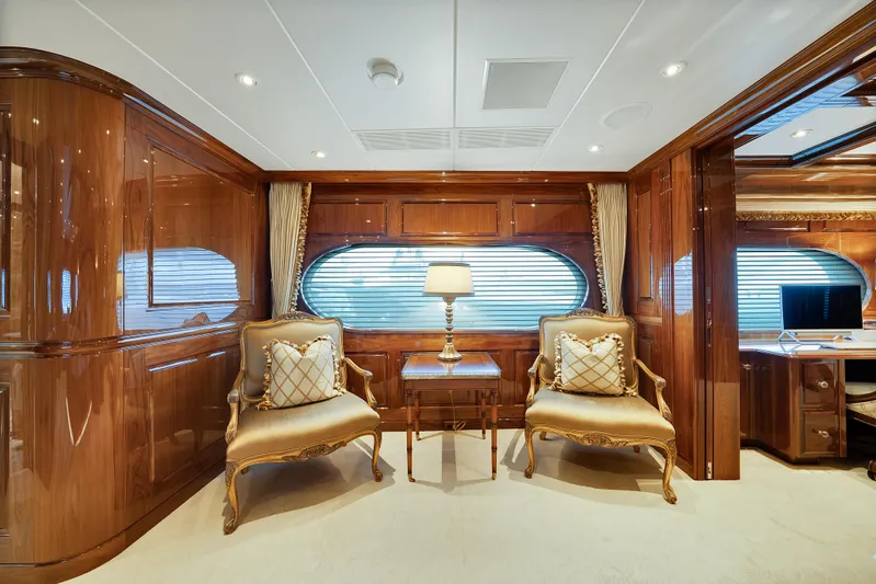 Silver Lining Yacht Photos Pics Luxurious interior of 2016 Christensen Tri-Deck yacht with elegant seating and wooden finishes.