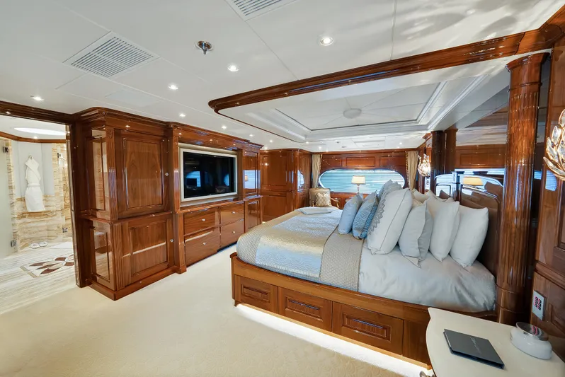 Silver Lining Yacht Photos Pics Luxurious bedroom interior on 2016 Christensen Tri-Deck yacht with elegant wood finishes.