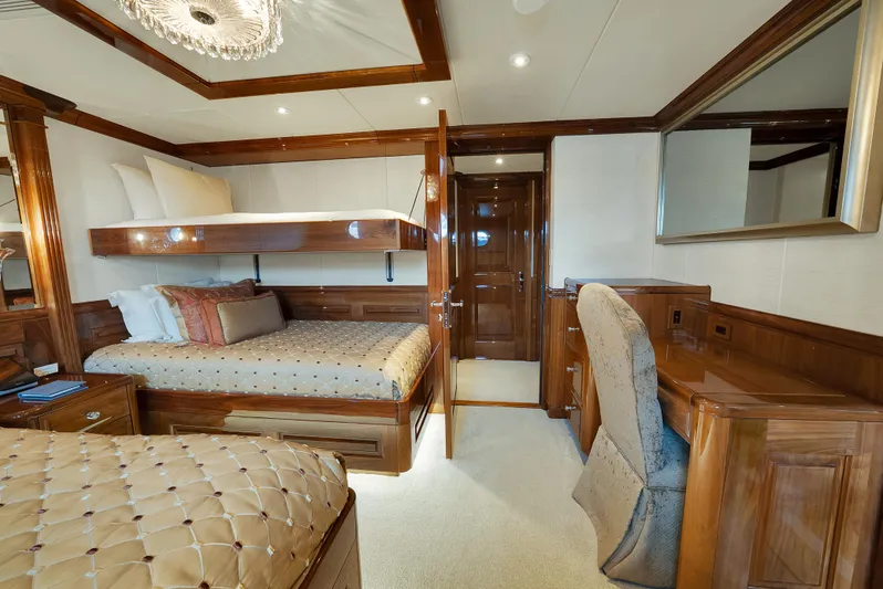Silver Lining Yacht Photos Pics Luxurious 2016 Christensen Tri-Deck yacht bedroom with elegant wood furnishings and plush bedding.