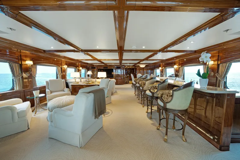 Silver Lining Yacht Photos Pics Luxurious interior of 2016 Christensen Tri-Deck yacht with elegant seating and bar area.