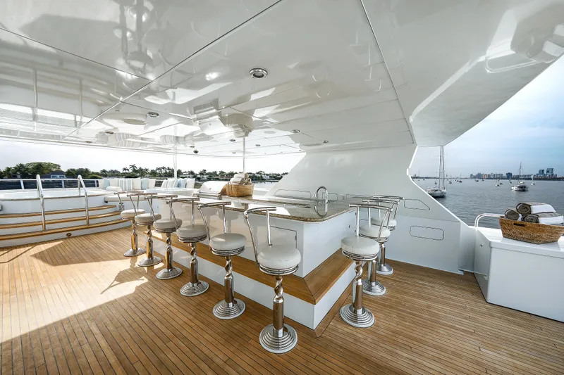 Silver Lining Yacht Photos Pics Luxurious 2016 Christensen Tri-Deck yacht with elegant outdoor bar and seating area.