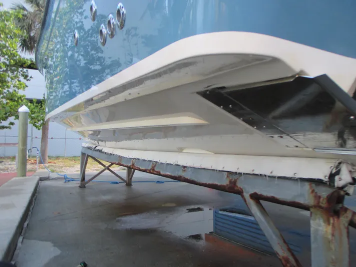  Yacht Photos Pics 2018 Grady-White Freedom 307 boat hull on a rusted trailer.