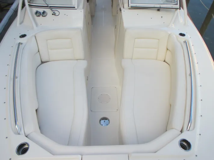  Yacht Photos Pics 2018 Grady-White Freedom 307 boat interior with white cushioned seating.