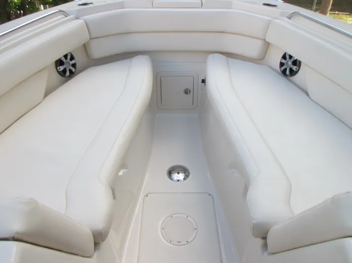  Yacht Photos Pics 2018 Grady-White Freedom 307 boat interior with white cushioned seating.