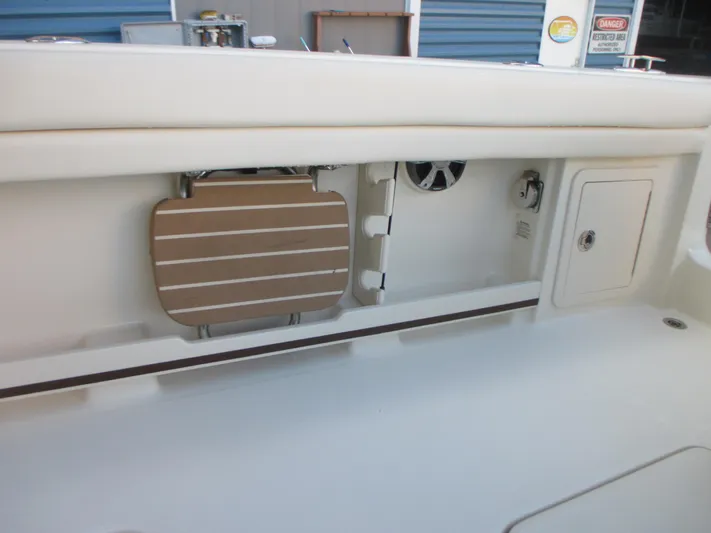  Yacht Photos Pics 2018 Grady-White Freedom 307 boat interior, featuring storage compartments and seating area.