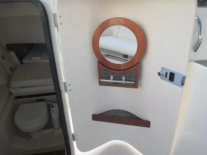  Yacht Photos Pics 2018 Grady-White Freedom 307 boat interior with bathroom and mirror.