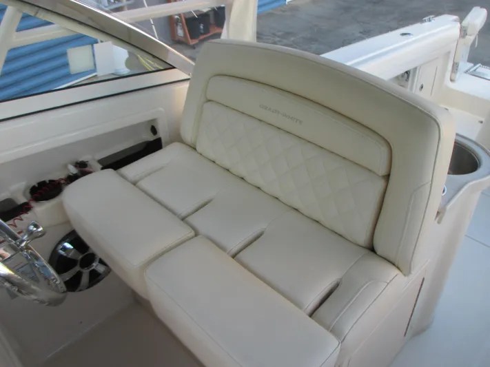  Yacht Photos Pics Luxurious seating on 2018 Grady-White Freedom 307 boat, featuring cream upholstery and elegant design.