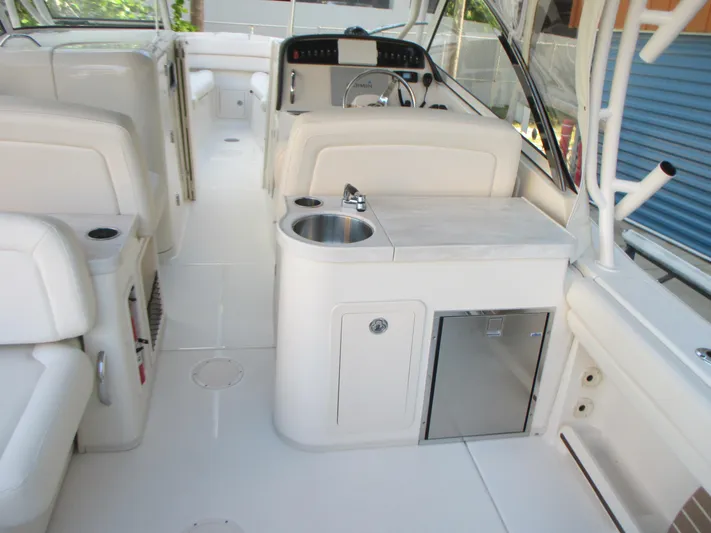  Yacht Photos Pics 2018 Grady-White Freedom 307 boat interior with sink and seating area.