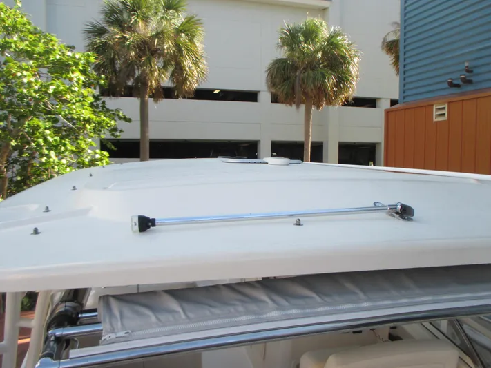  Yacht Photos Pics 2018 Grady-White Freedom 307 boat roof with palm trees in the background.