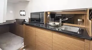  Yacht Photos Pics 2024 Beneteau 29' Flyer 9 SUNdeck interior kitchen with modern amenities and sleek design.