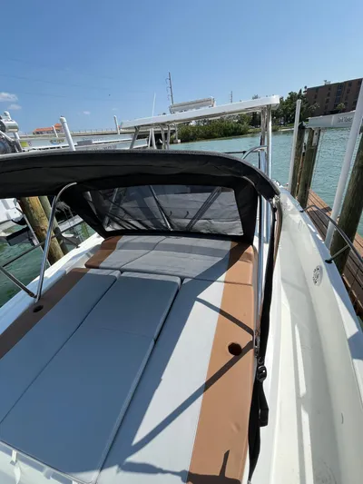  Yacht Photos Pics 2024 Beneteau 29' Flyer 9 SUNdeck boat docked by the water.