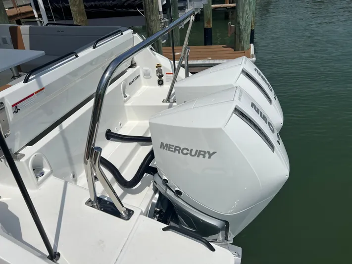  Yacht Photos Pics 2024 Beneteau Flyer 9 SUNdeck with dual Mercury outboard engines docked.