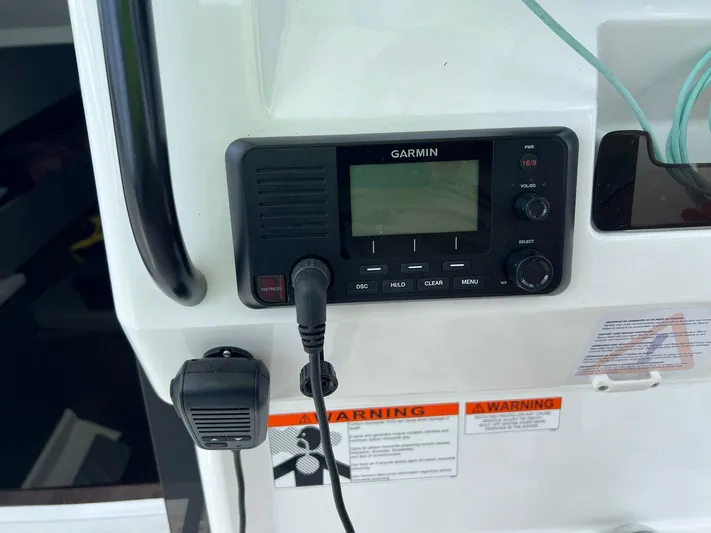  Yacht Photos Pics Garmin device on 2024 Beneteau 29' Flyer 9 SUNdeck with warning labels visible.