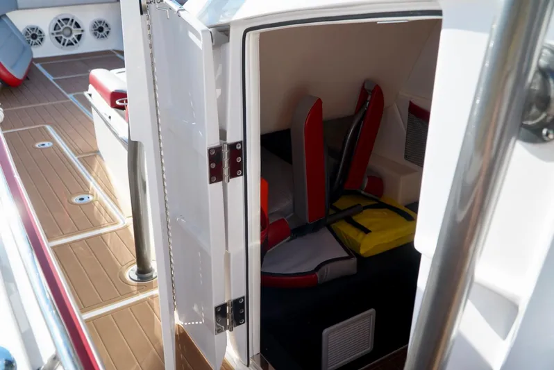  Yacht Photos Pics 2021 Nor-Tech 392 Superfish cabin interior with seating and life jacket.