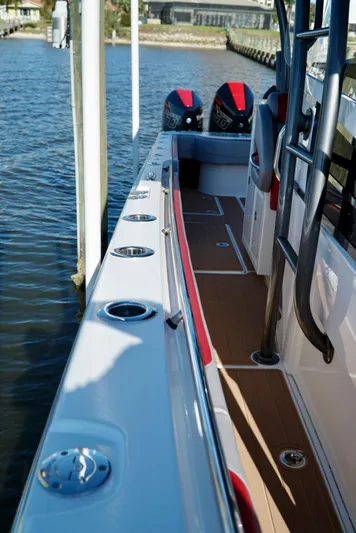  Yacht Photos Pics 2021 Nor-Tech 392 Superfish boat docked, showcasing deck and twin outboard engines.