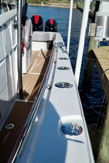  Yacht Photos Pics 2021 Nor-Tech 392 Superfish boat docked, showcasing deck and rod holders.