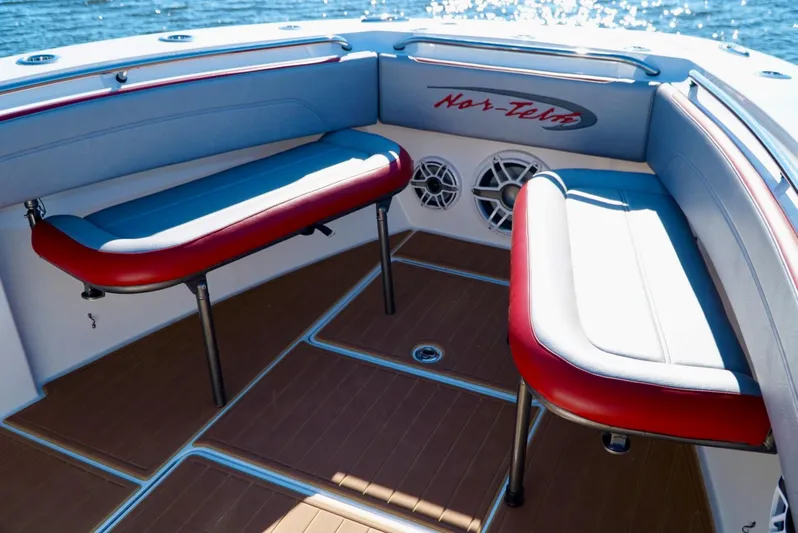  Yacht Photos Pics 2021 Nor-Tech 392 Superfish boat interior with red and white seating, wooden flooring, and speakers.