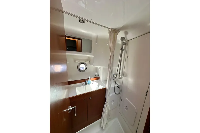 Dark Star Yacht Photos Pics Bathroom interior of 2016 Beneteau Swift Trawler 34 with shower and sink.