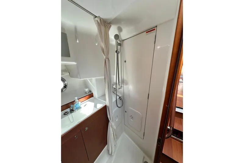 Dark Star Yacht Photos Pics Bathroom interior of 2016 Beneteau Swift Trawler 34 with shower and sink.