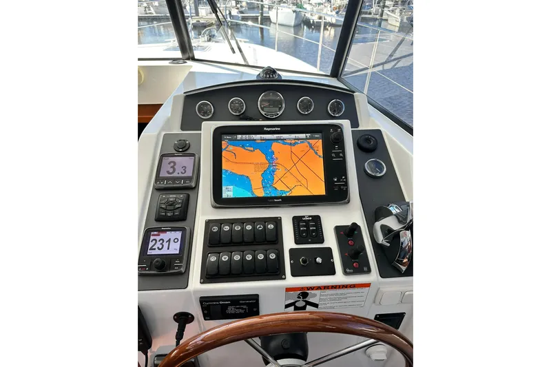 Dark Star Yacht Photos Pics 2016 Beneteau Swift Trawler 34 helm with navigation display and controls.