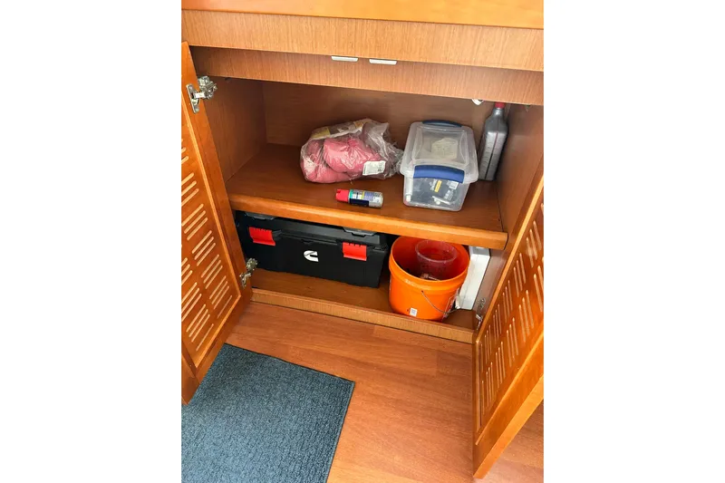Dark Star Yacht Photos Pics Storage cabinet on 2016 Beneteau Swift Trawler 34 with tools and supplies.