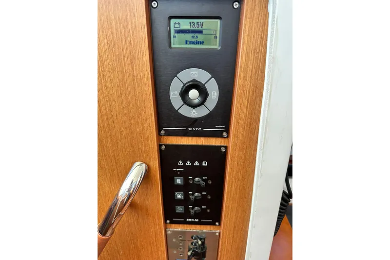 Dark Star Yacht Photos Pics Control panel of 2016 Beneteau Swift Trawler 34, featuring digital display and switches.