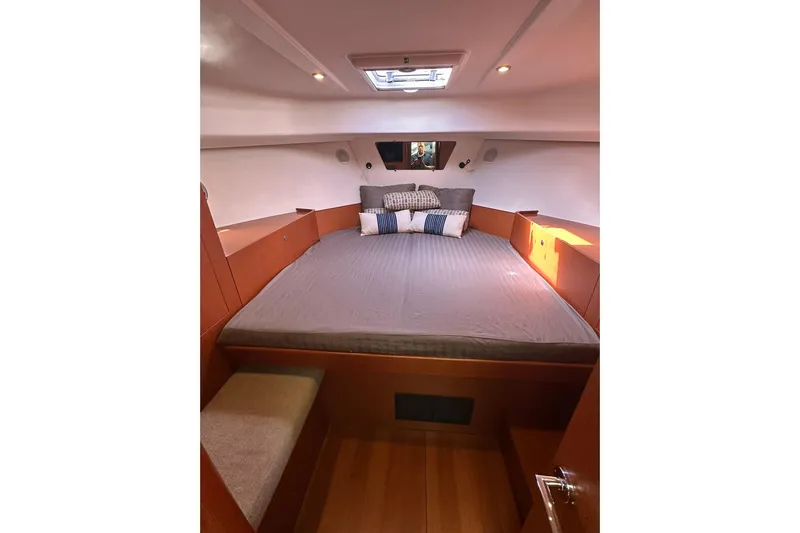 Dark Star Yacht Photos Pics Cozy cabin interior of 2016 Beneteau Swift Trawler 34 with comfortable bedding.