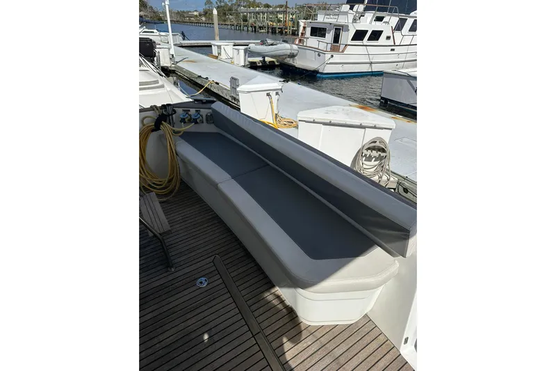 Dark Star Yacht Photos Pics Beneteau Swift Trawler 34, 2016 model, featuring a sleek deck seating area.