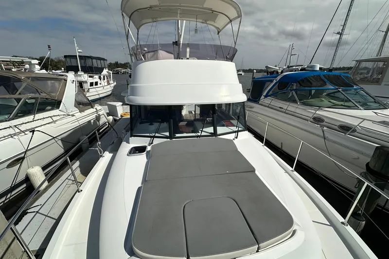 Dark Star Yacht Photos Pics 2016 Beneteau Swift Trawler 34 docked, showcasing spacious deck and sleek design.