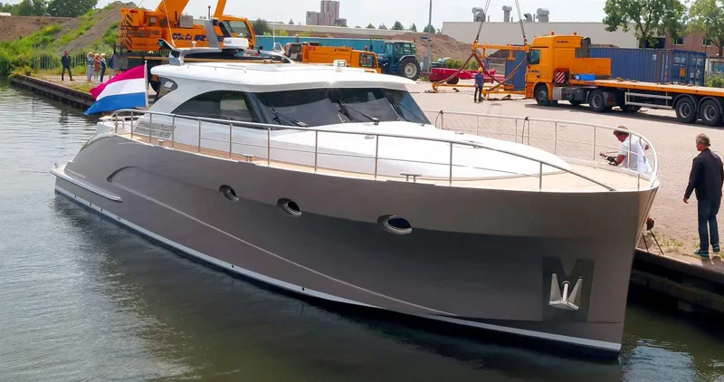  Yacht Photos Pics Luxury yacht Van der Heijden Exclusive Deluxe 1700, 2023 model, docked at a marina.