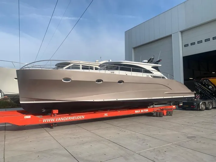  Yacht Photos Pics 2023 Van der Heijden Exclusive Deluxe 1700 yacht on trailer outside a warehouse.