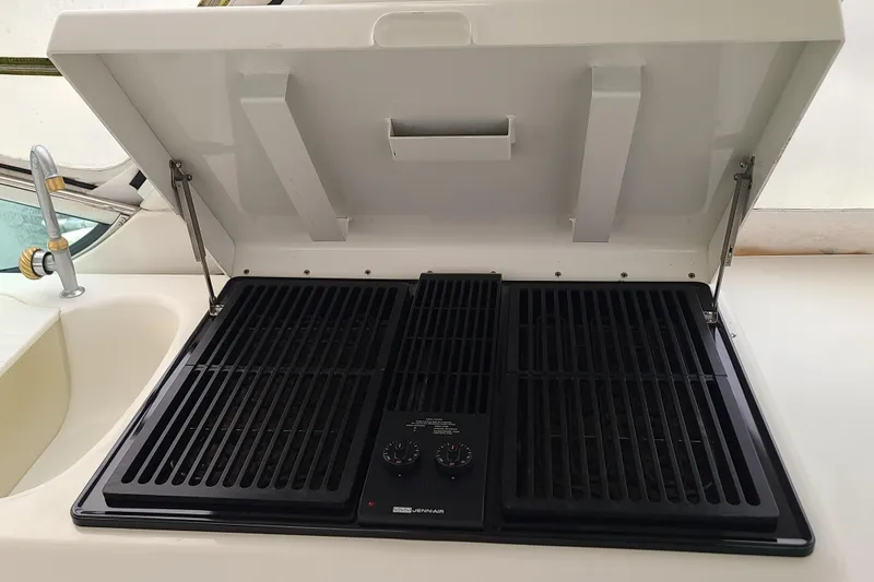 Sea Spirit Yacht Photos Pics Outdoor grill featuring dual burners and protective cover.