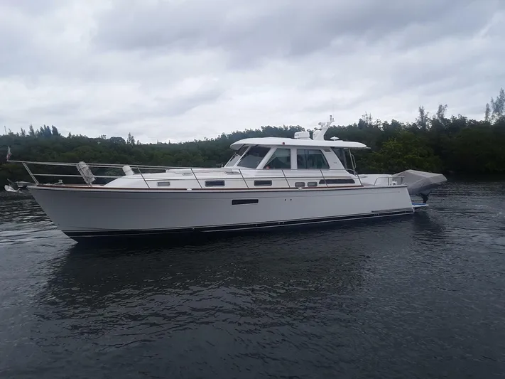Happy Days Yacht Photos Pics 2016 Sabre 48 Salon Express yacht cruising on a calm waterway.