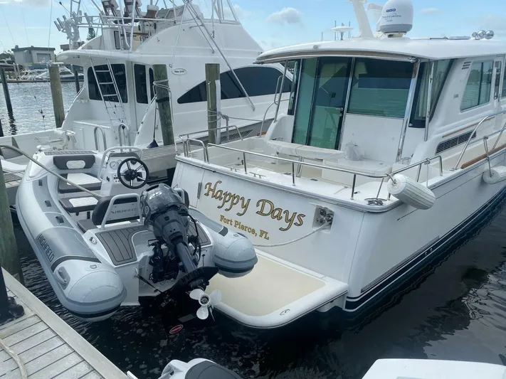 Happy Days Yacht Photos Pics 2016 Sabre 48 Salon Express yacht named "Happy Days" docked with inflatable boat.