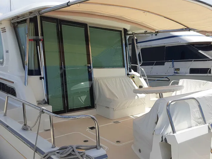 Happy Days Yacht Photos Pics 2016 Sabre 48 Salon Express yacht with covered deck and seating area.