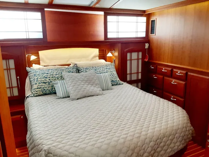 Happy Days Yacht Photos Pics Luxurious bedroom interior of 2016 Sabre 48 Salon Express yacht with elegant wood finish.