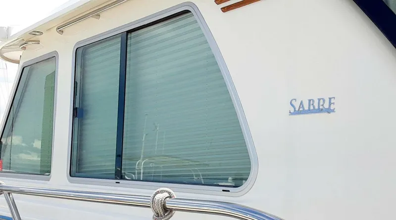 Happy Days Yacht Photos Pics 2016 Sabre 48 Salon Express yacht with sleek window design and logo.