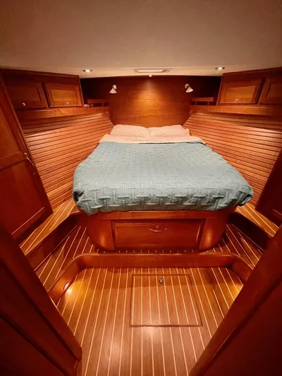 Happy Days Yacht Photos Pics 2016 Sabre 48 Salon Express cabin with wooden interior and cozy bed.