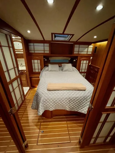 Happy Days Yacht Photos Pics Luxurious cabin interior of 2016 Sabre 48 Salon Express yacht with elegant wood finish.