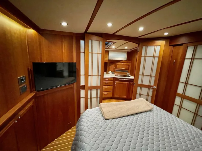 Happy Days Yacht Photos Pics Luxurious interior of 2016 Sabre 48 Salon Express yacht with wood paneling and modern amenities.