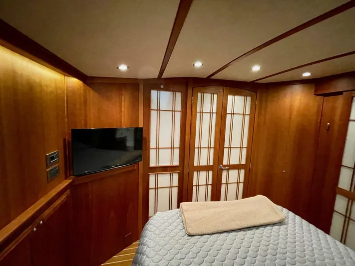 Happy Days Yacht Photos Pics Luxurious interior of 2016 Sabre 48 Salon Express yacht with wood paneling and TV.