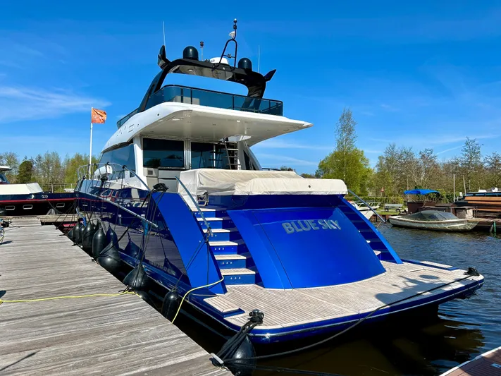  Yacht Photos Pics Luxury Van der Heijden Phantom 70 Fly yacht docked, 2021 model, vibrant blue exterior.
