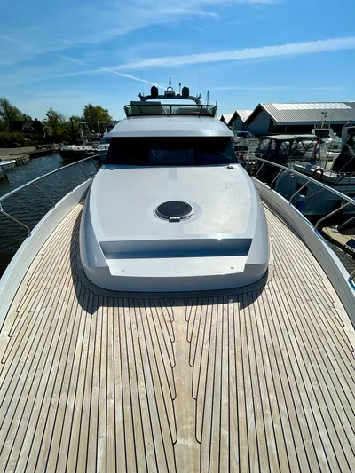 Yacht Photos Pics Van der Heijden Phantom 70 Fly 2021 yacht with sleek deck design under clear blue sky.