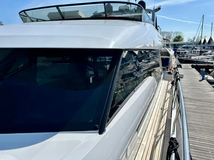  Yacht Photos Pics Van der Heijden Phantom 70 Fly 2021 yacht docked at marina, side view.