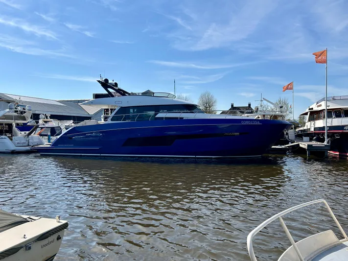  Yacht Photos Pics Van der Heijden Phantom 70 Fly 2021 yacht docked in a marina under clear skies.